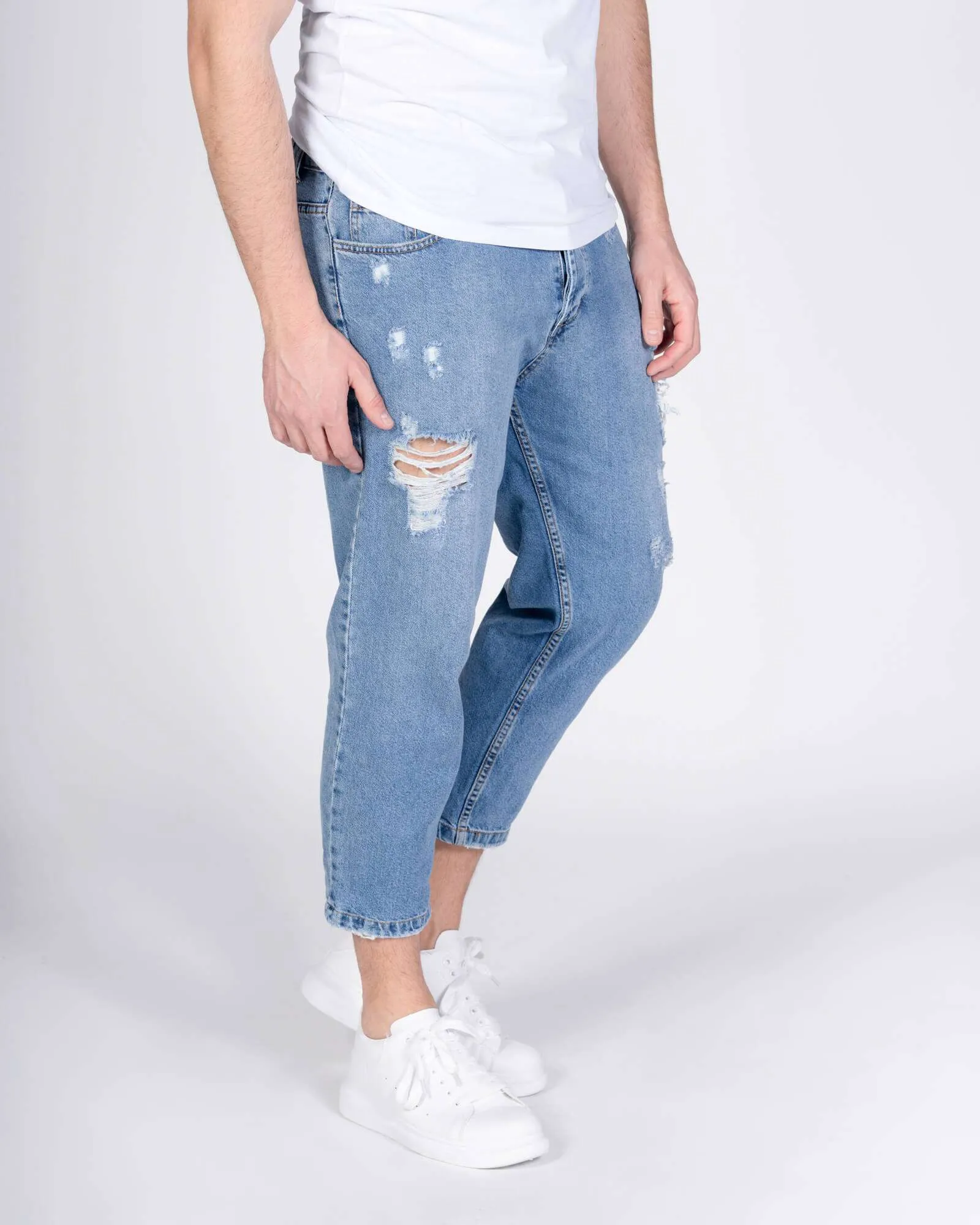 Jeans largo con strappi