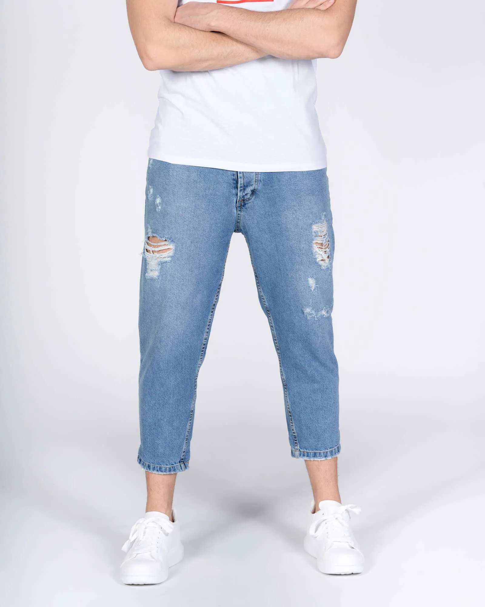Jeans largo con strappi